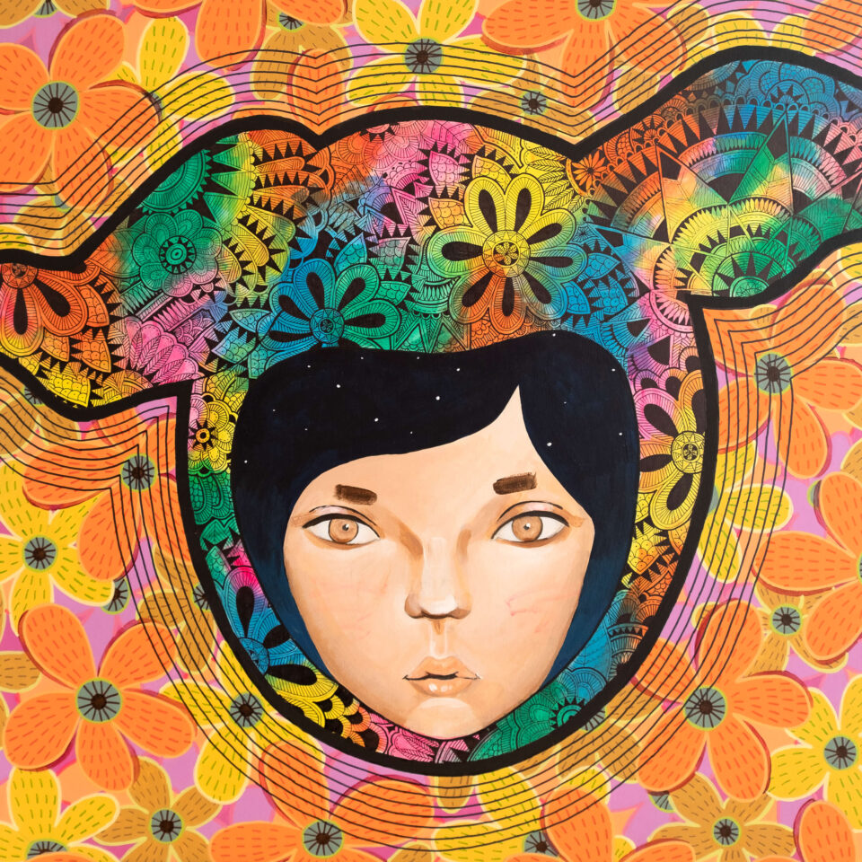 A female face in a rainbow rabbit cap with pen details on the background of orange, pink, and yellow flowers on the wood panne.